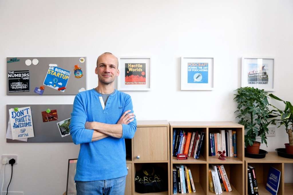 Colin in the podcast host offices