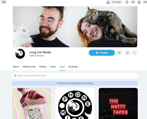 Long Cat Media's Ko-Fi page includes a storefront to sell their podcast merchandise.